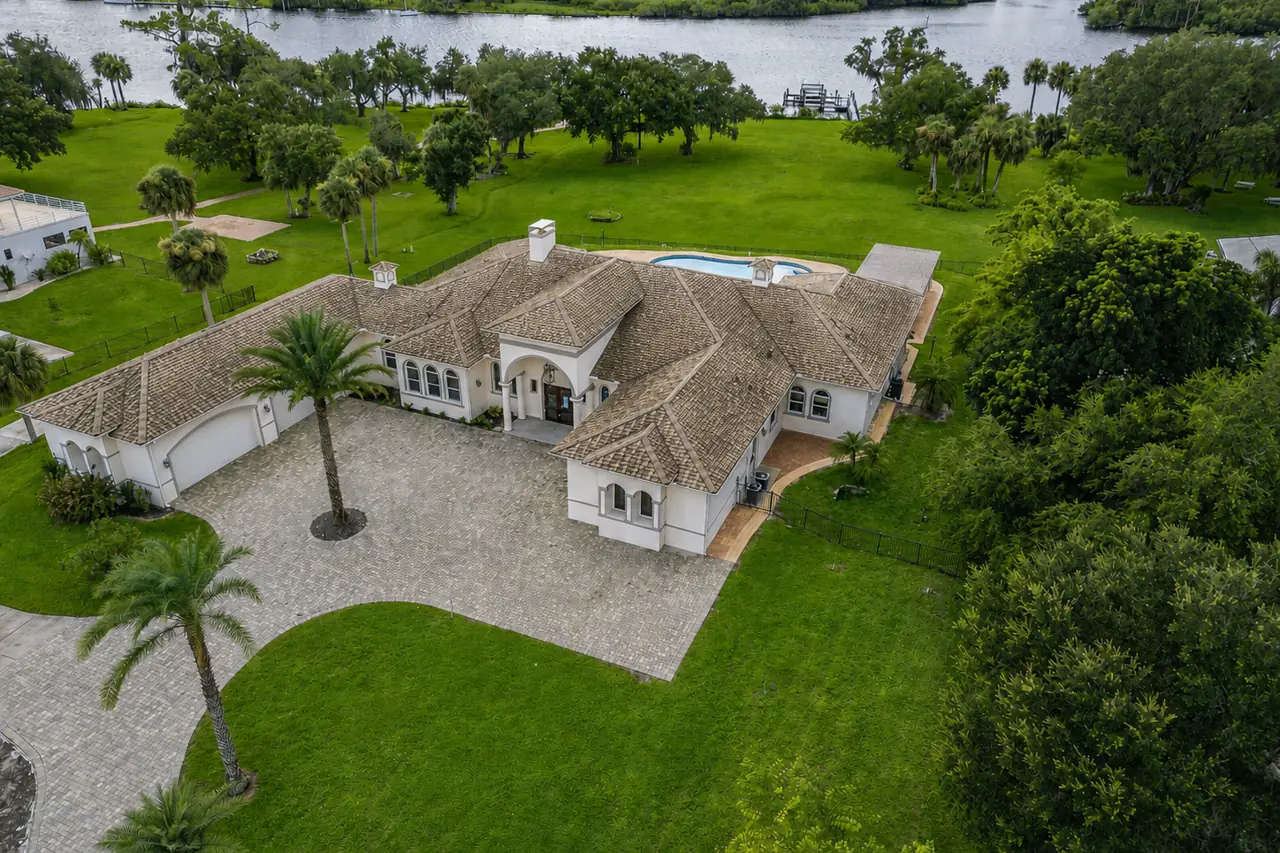 The waterfront estate with its aging tile roof