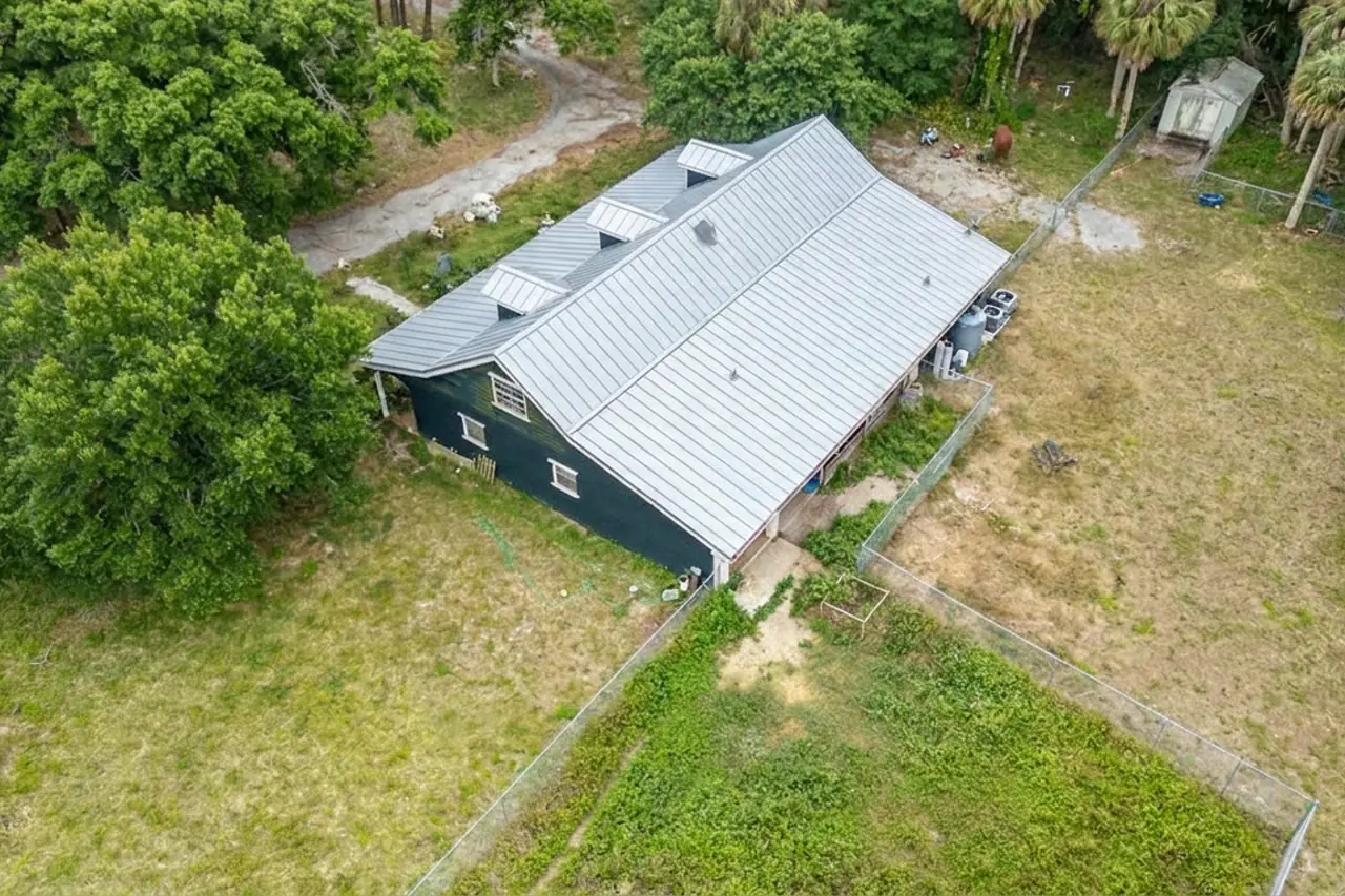 The rear of the home with the new metal roof