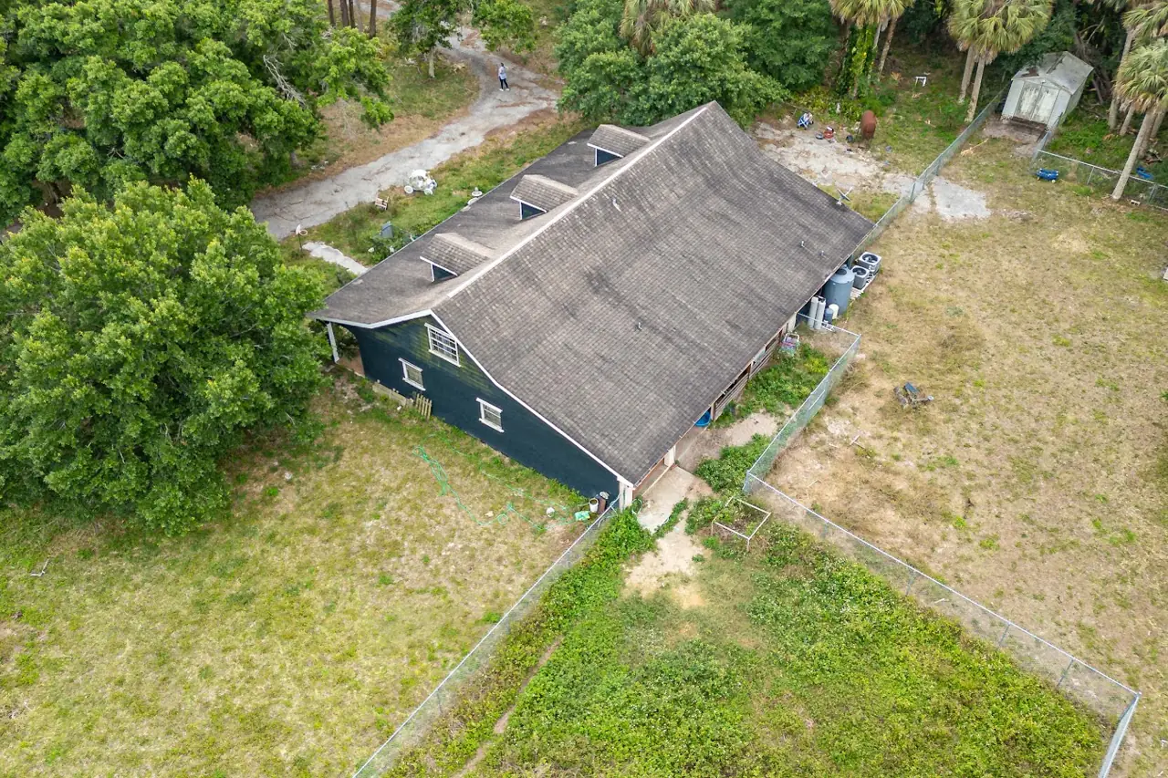 The rear of the home before the reroof