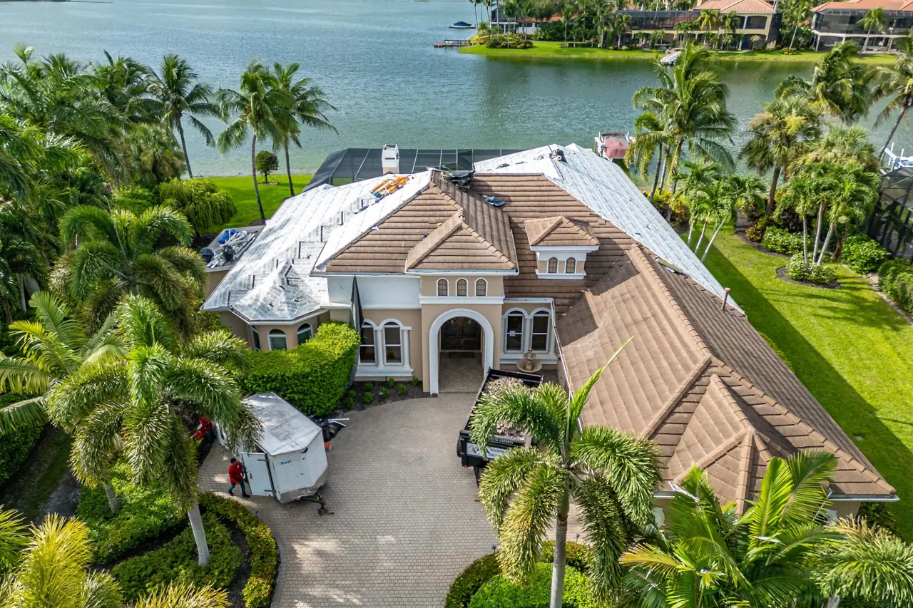 The lakefront home during roof tear-off